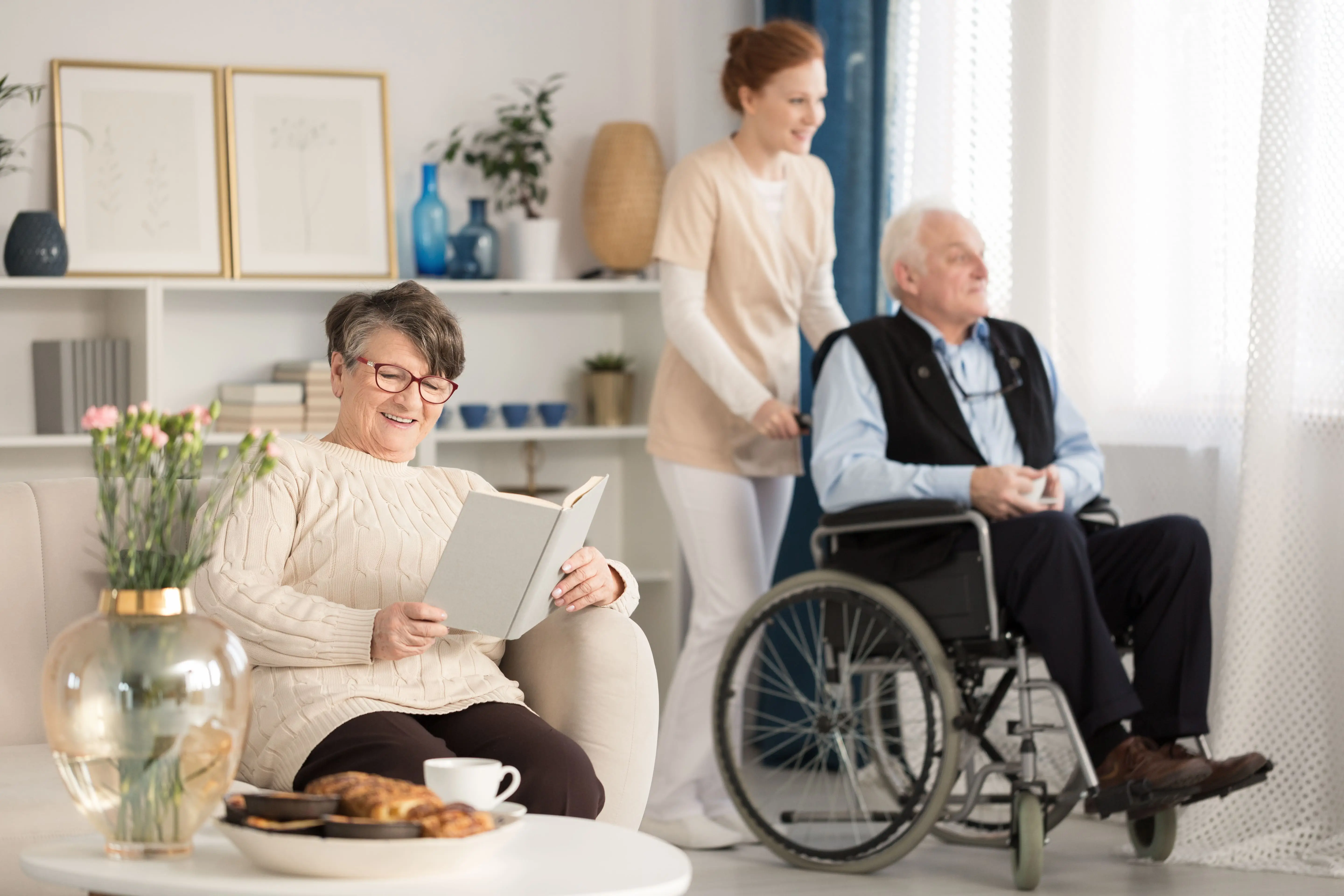 OC HomeCare caregiver providing compassionate wheelchair assistance in a peaceful, home-like assisted living setting in Cypress, California
