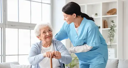 OC HomeCare caregiver supporting elderly woman at home in Orange County, CA with compassionate personal care