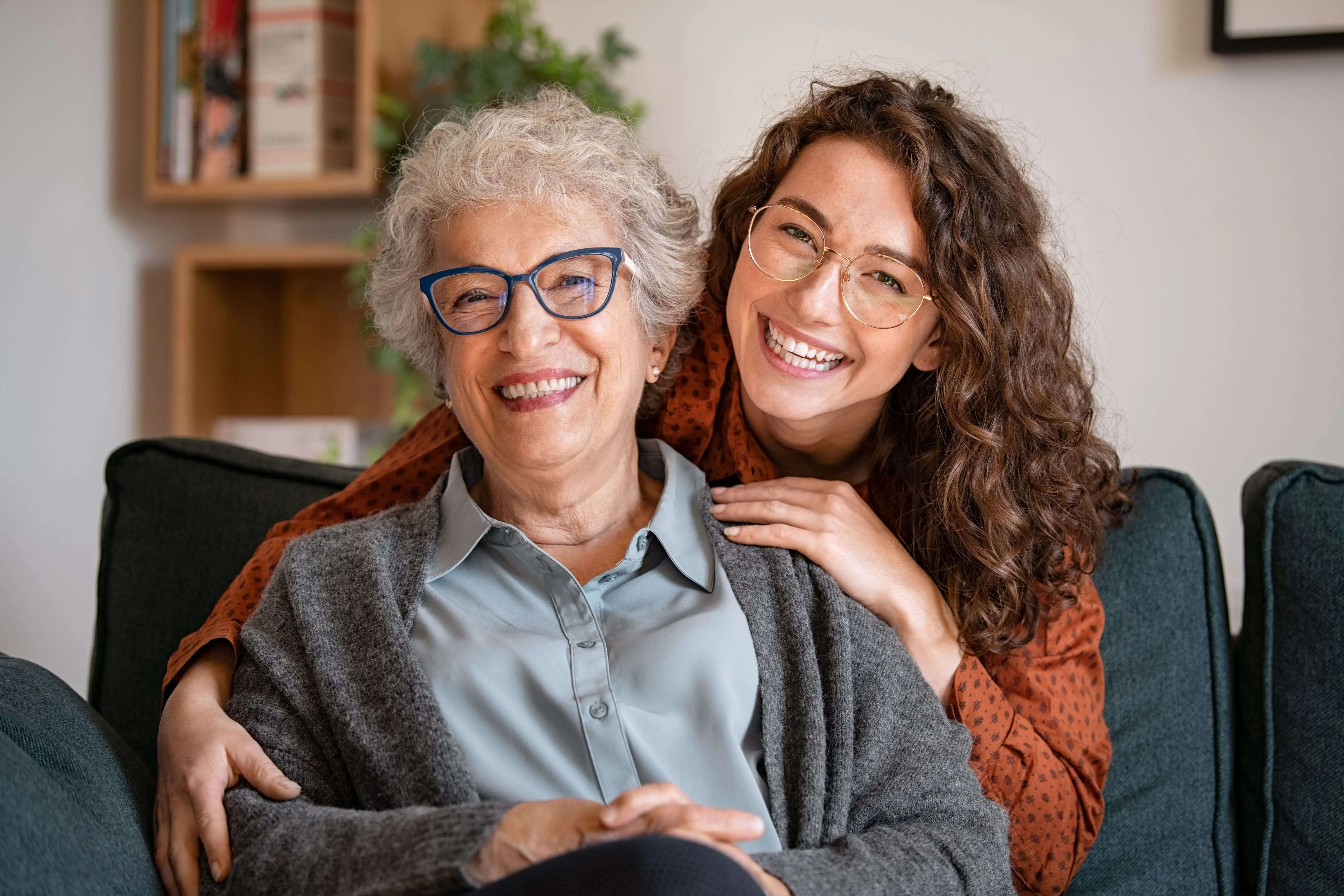 OC HomeCare client sharing joyful moment with family member, symbolizing trusted in-home senior care in Orange County, CA