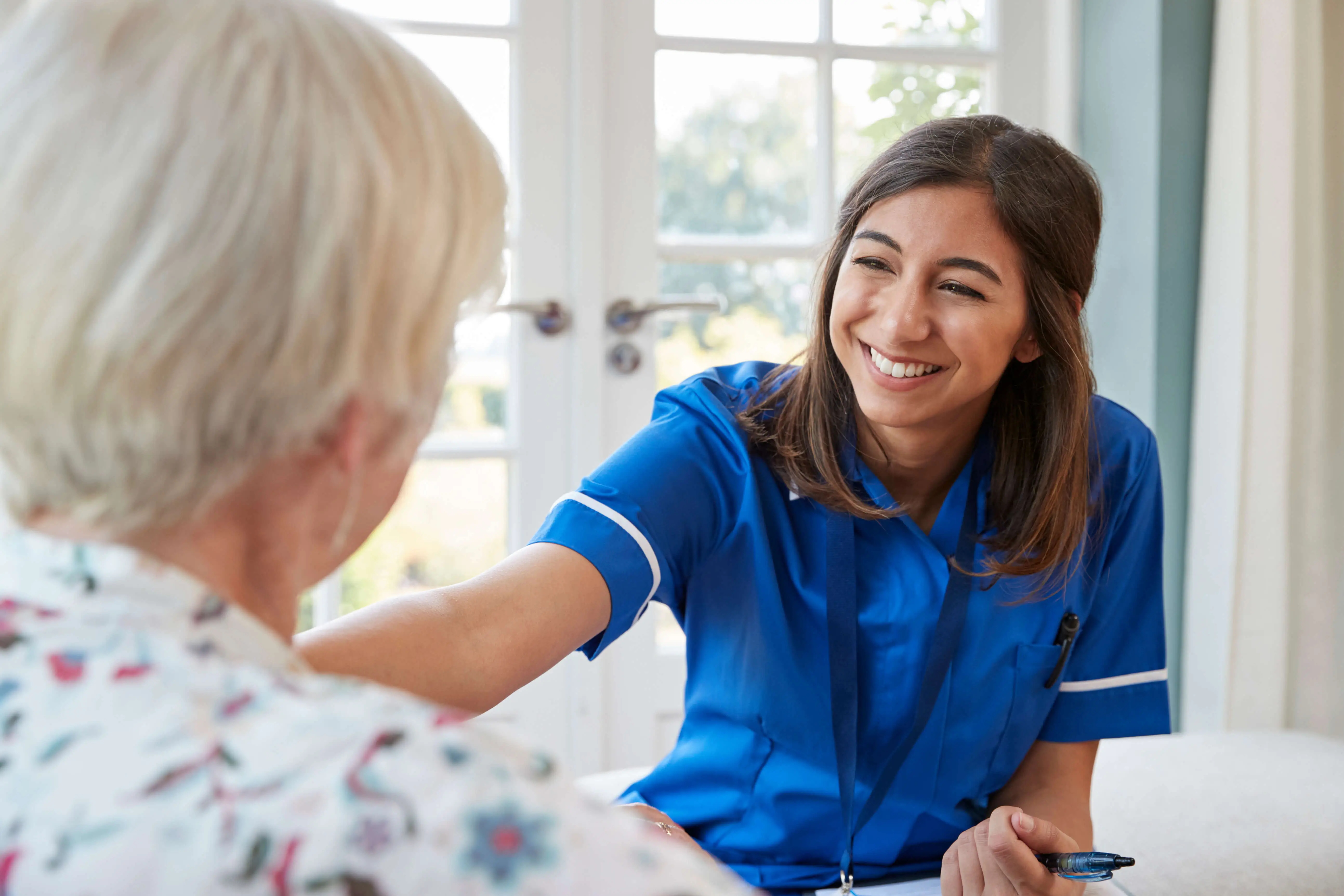 Smiling OC HomeCare caregiver offering friendly, personalized in-home senior care in Cypress, California