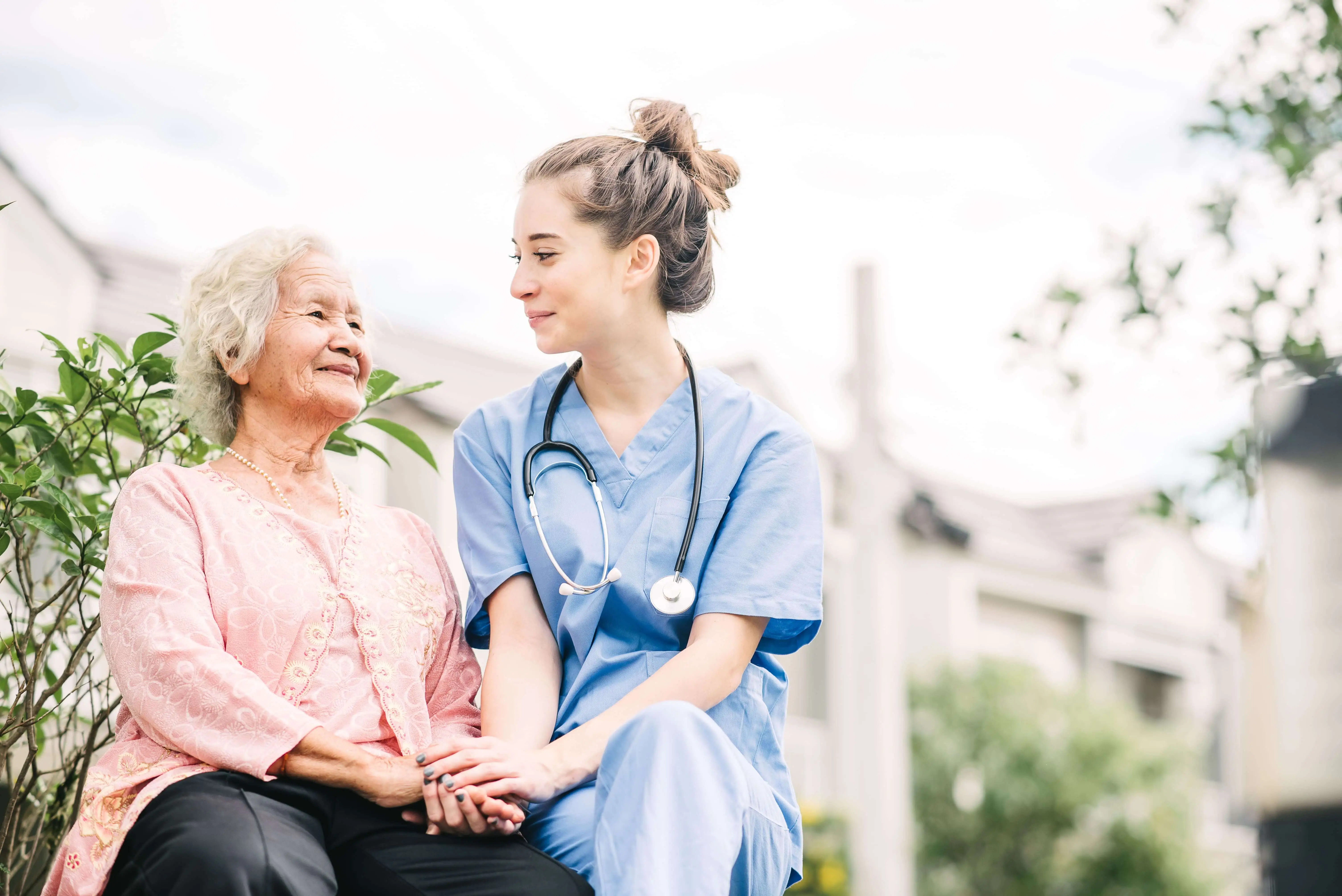 OC HomeCare nurse providing compassionate outdoor senior care in a peaceful residential setting near Fullerton, CA – Trusted elder support and nursing services