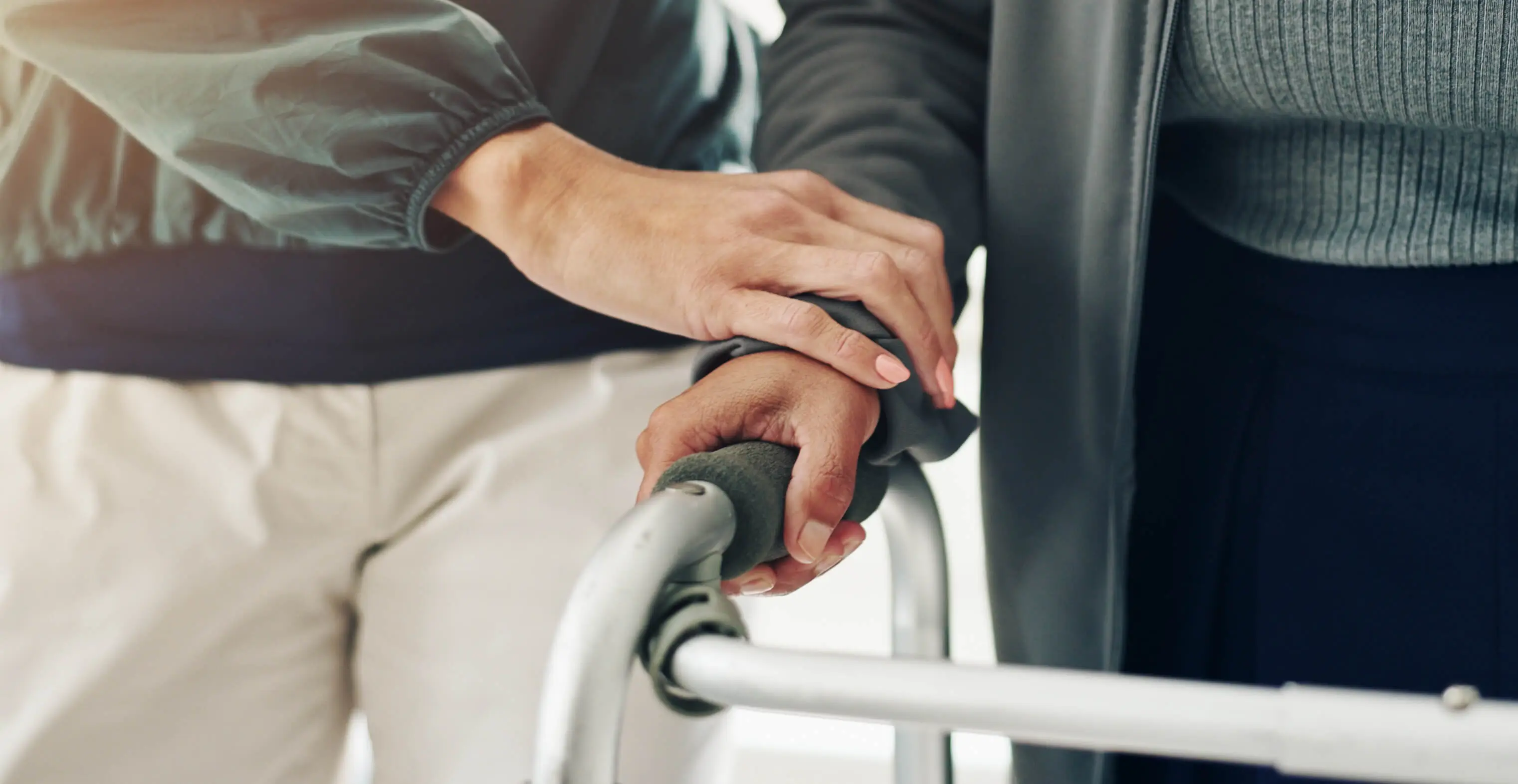 OC HomeCare caregiver providing compassionate in-home companion care and walker assistance to senior in Stanton, CA